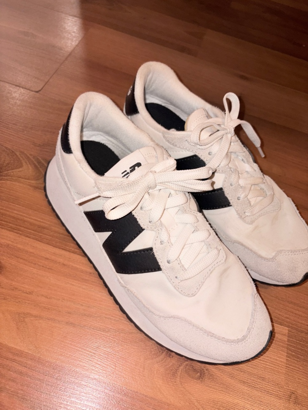 New Balance White Sneakers with Black 'N' Accent